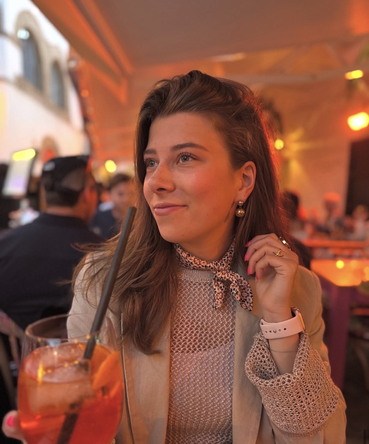 Woman wearing a Misa scarf at an evening venue