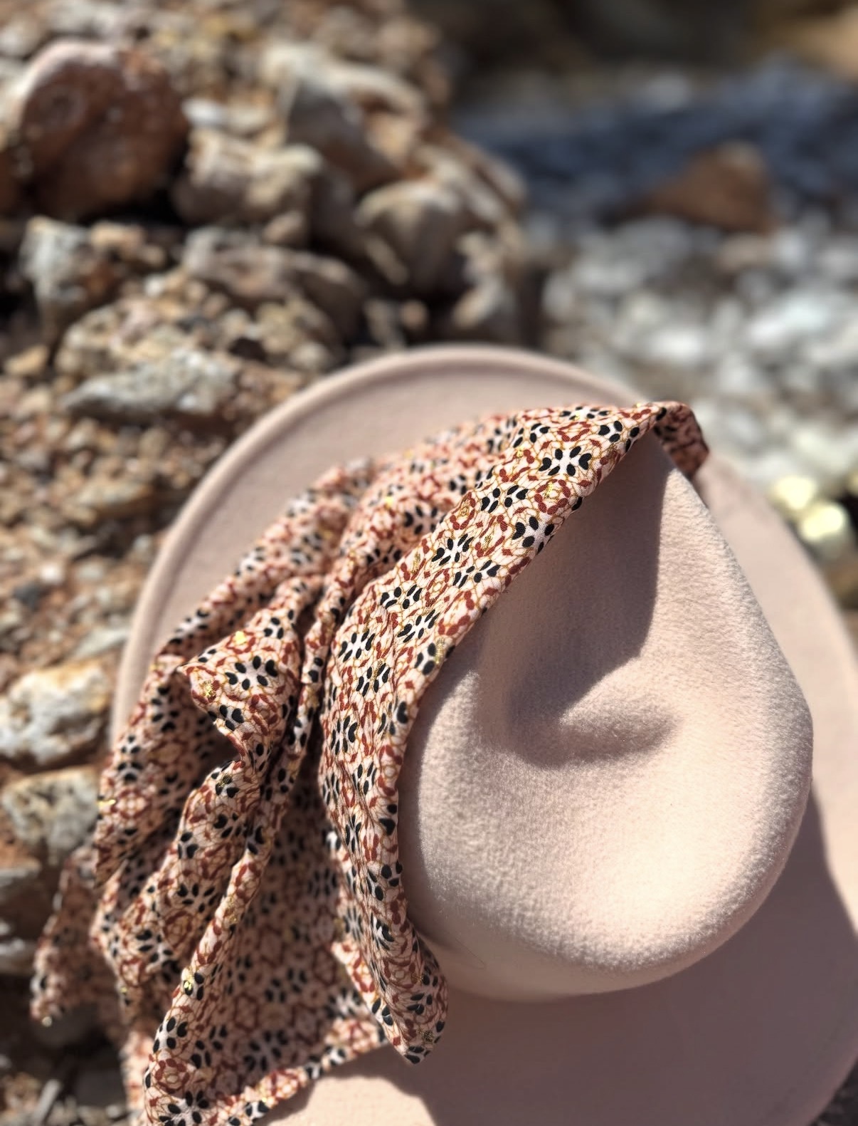 Misa scarf styled on a sunhat by the sea