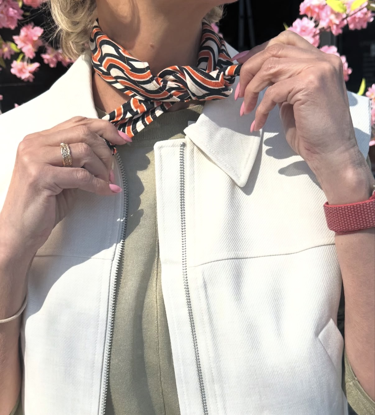 Misa striped scarf styled around the neck